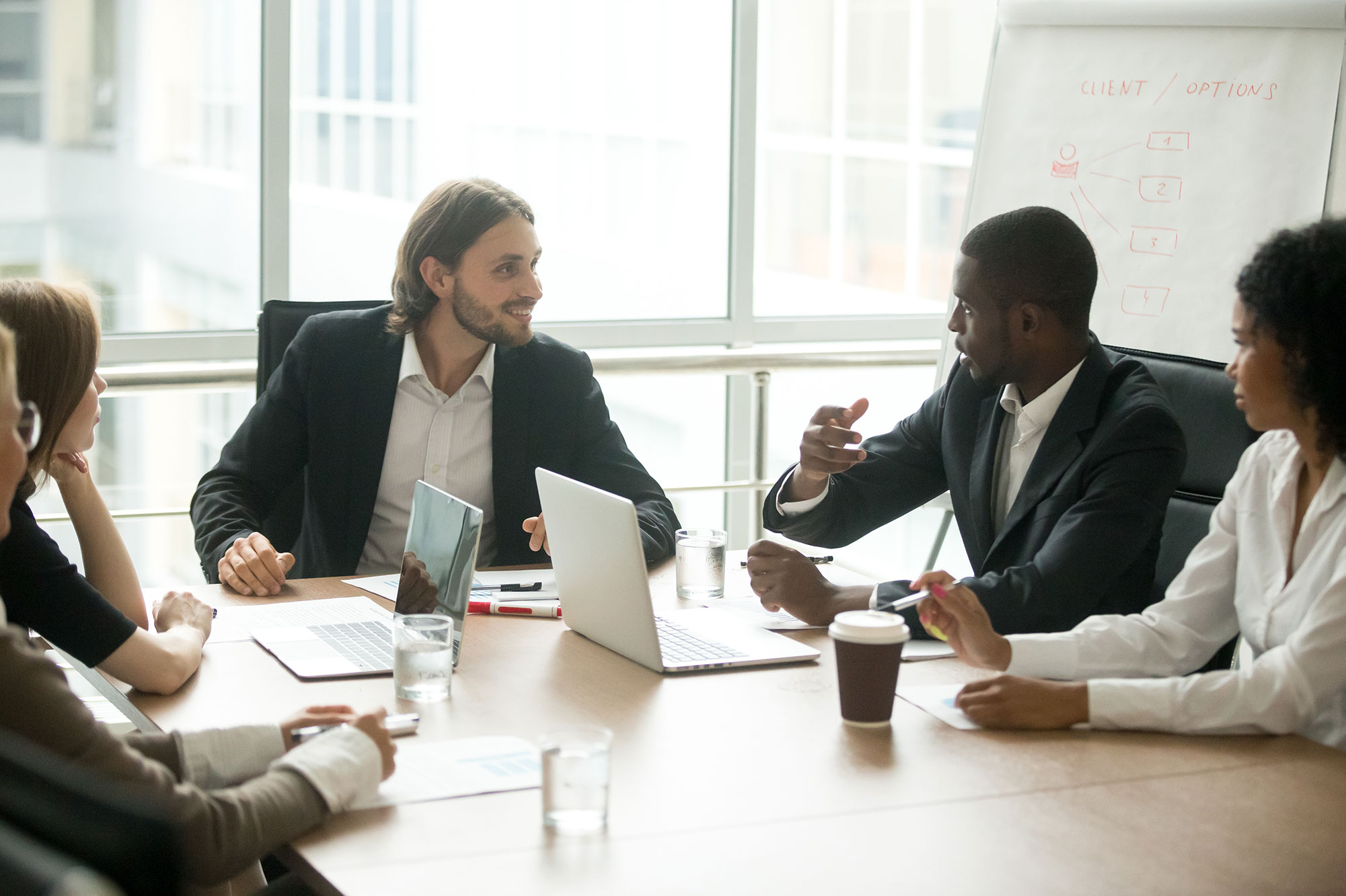 business executives discussing project ideas at te la7952r.jpg