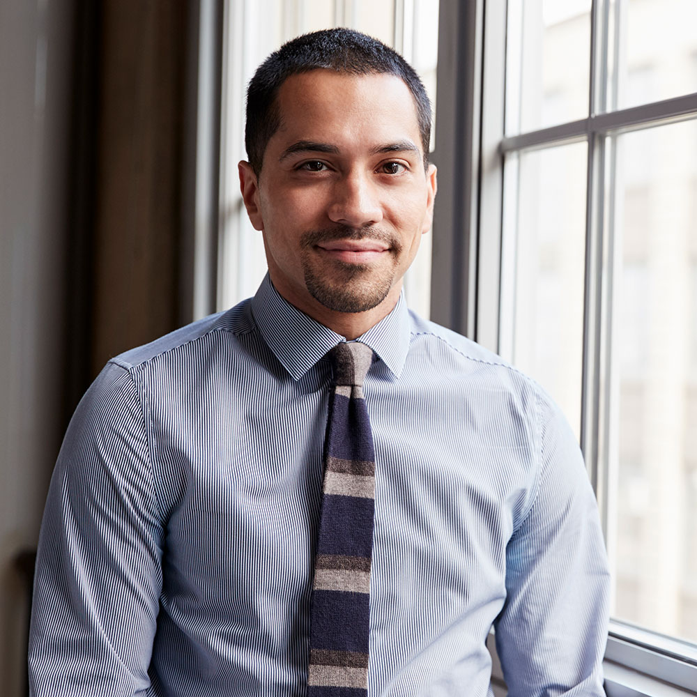 young hispanic business man smiling to camera pgjv4ck.jpg